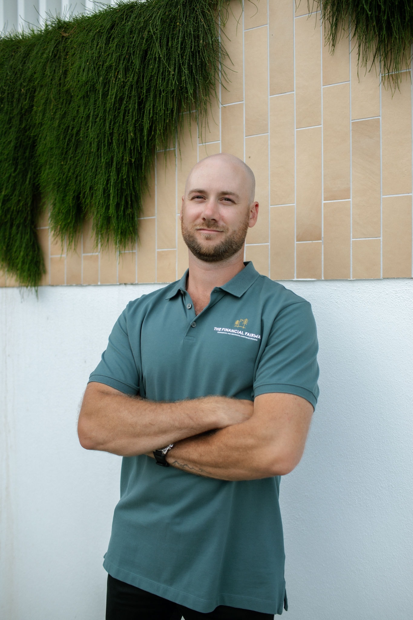 James — Founder and Principal Broker at The Financial Fairway, standing on a golf course at sunset